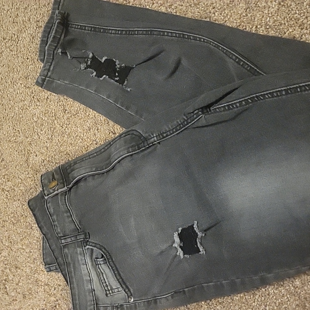 Distressed black skinny jeans